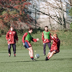 Manchester United in training. Roy Keane and Paul Scholes practicing watched by