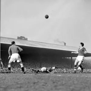 Manchester United versus Cardiff City Roger Byrne heads almost into his own goal