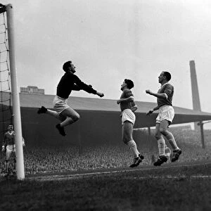 Manchester United versus Manchester City-United goalkeeper Harry Gregg clears