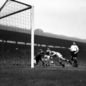 Manchester United versus Preston North End Dennis Viollet leaps to score the thrd