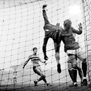 Manchester United versus West Ham. Denis Law ends up in the net as West Ham keeper