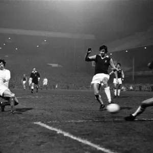 Manchester United winger Willie Morgan attempts a shot on goal at Villa Park during their