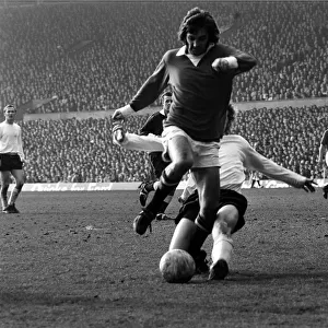 Manchester Uniteds George Best is challenge by Stoke defender March 1972