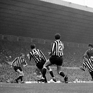 Manchester Uniteds Willie Morgan takes on four Newcastle united defenders in a goal