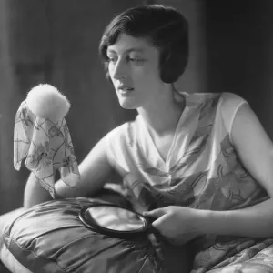 Mannequin seen here applying powder before a fashion shoot for the latest 1932 fashions