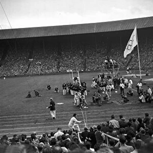 Marathon race runner crosses the finish line August 1948 at Wembley during