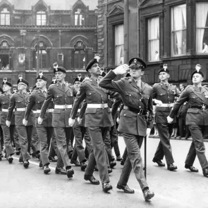 A march past by the Royal Northumberland Fusiliers in front of the Station Hotel in