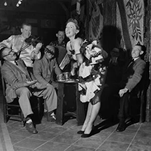 Margaret Madison, 26-year-old redhead, dances the can-can nightly in a Rodley (yorkshire