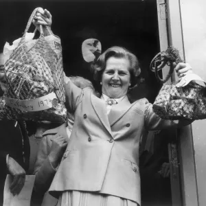 Margaret Thatcher holds shopping bags print, 1979 Margaret Thatcher holds shopping bags print, 1979