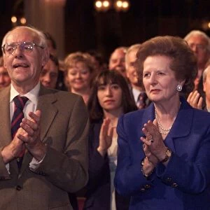 Margaret Thatcher and husband Denis Thatcher applauding a speech by Lord Archer at