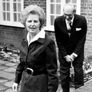 Margaret Thatcher and husband Denis Thatcher as she leaves for work - March 1977