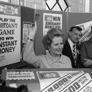 Margaret Thatcher October 1977 holds up an instant game ticket at the Conservative Party