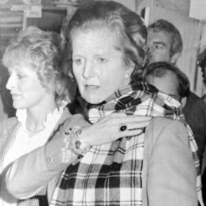 Margaret Thatcher PM tries on a tartan scarf at Elgin, Scotland, June 1983