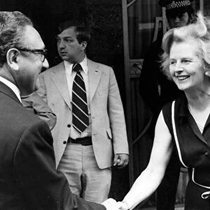 Margaret Thatcher shaking hands with Henry Kissinger outside Claridiges