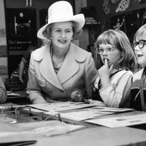 Margaret Thatcher sits with children taking a reading class at the Northern Councties Margaret Thatcher sits with children taking a reading class at the Northern Councties