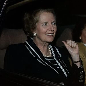 Margaret Thatcher sitting in car being Driven
