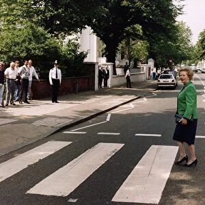 Margaret Thatcher walking across zebra crossing in Abbey Road made famous by the Beatles