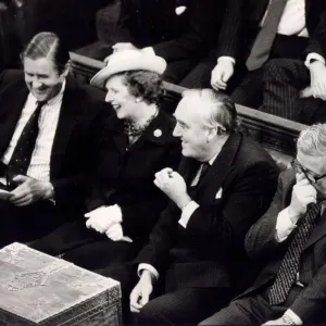 Margaret Thatcher with William Whitelaw and Sir Geoffrey Howe laughing on front bench in Margaret Thatcher with William Whitelaw and Sir Geoffrey Howe laughing on front bench in