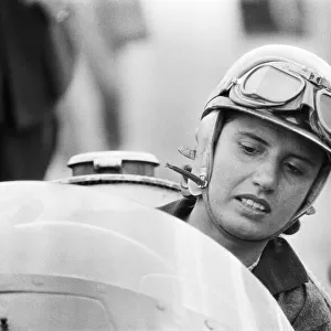 Maria Teresa de Filippis pictured in her Red Maserati 250F before for the BRDC