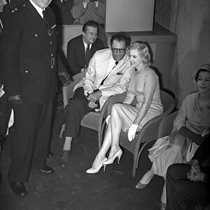 Marilyn Monroe with Arthur Miller at London airport and actress Vivien Leigh July