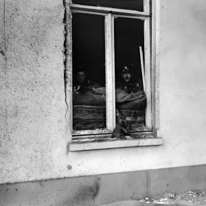 Marines of the British Naval Brigade seen here sniping at the enemy from the windows of