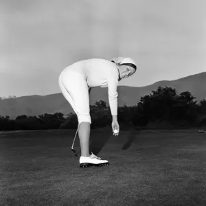 Marion Jones, 22, who took up golf a few weeks ago. She cut down a pair of slacks to Marion Jones, 22, who took up golf a few weeks ago. She cut down a pair of slacks to