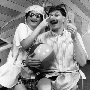 Mark Kendall in Bermuda shorts and red nose, 8th February 1989 Print
