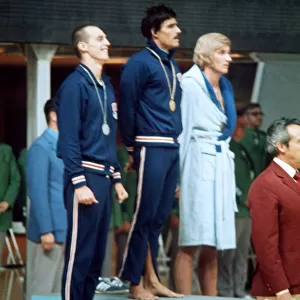 Mark Spitz swimmer 1972 Munich Olympics on rostrum receiving gold medal track suit