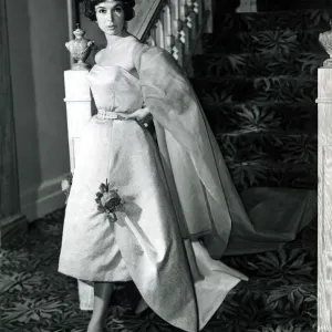 Marla Scarafia Woman coming down the stairs pouting dramatically at the camera in a Marla Scarafia Woman coming down the stairs pouting dramatically at the camera in a
