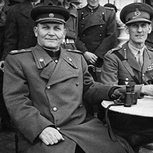 Marshal Ivan Koniev of the Russian Army (left) shares a table with British