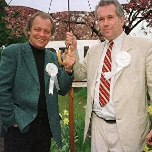 Martin Bell shares umbrella with actor David Sole during his election campaign April