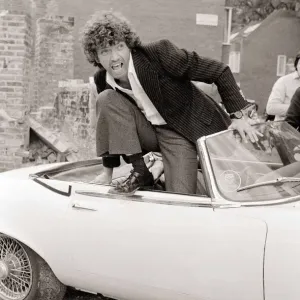Martin Shaw Jumping out of a white convertable car on the set of The Professionals Martin Shaw Jumping out of a white convertable car on the set of The Professionals
