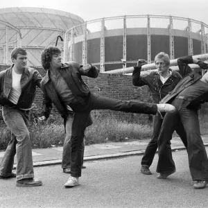 Martin Shaw and Lewis Collins wrestling with the bad guys on the set of the television