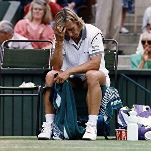 Martina Navratilova hangs her head in despair after Monica Seles had bundled her out of