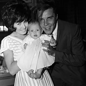 Marty Wilde at London Airport with his wife Joyce and their six month old daughter Kim