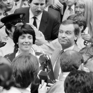 Mary and Jeffrey Archer show their delight in the crowd outside the High Court as they Mary and Jeffrey Archer show their delight in the crowd outside the High Court as they