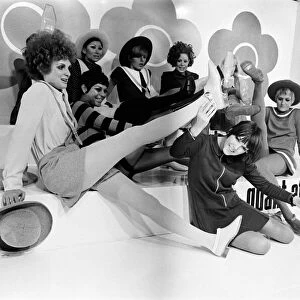 Mary Quant pictured in black, sitting down at the front