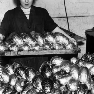 Mary Timney brings out a finished tray of eggs, which are wrapped Mary Timney brings out a finished tray of eggs, which are wrapped