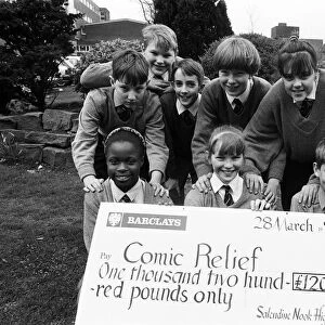 Masters of the roles... Salendine Nook High School pupils with a huge cheque for the huge