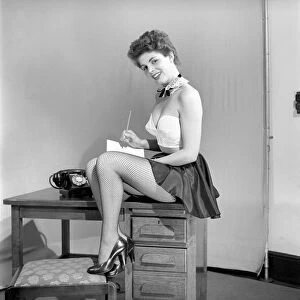 Maureen O Neill poses as a secretary. 1962