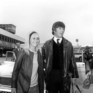 May 1964 John Lennon with his wife Cynthia walk to the car as they arrive back in England