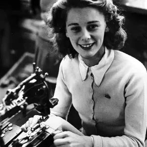 Mayme Bell Sewing machinist putting buttons onto golf cardigan knitware worker factory Mayme Bell Sewing machinist putting buttons onto golf cardigan knitware worker factory