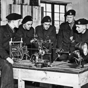Maze of wires inside a tank presents no problems to these members of a West Country Tank