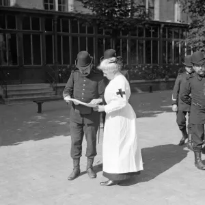 A member of the Belgian Civil Guard seen here in Brussels with Red Cross nurse Circa