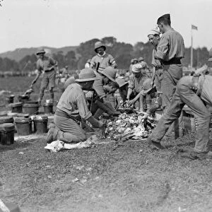 Members of the 1st Manchester Regiment seen here in their field kitchen at the the race