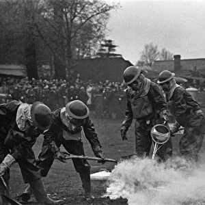 Members of the ARP demonstrate how to deal with a suspected gas attack during a series of
