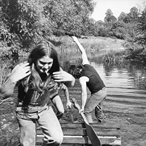 Members of Heavy Metal group Black Sabbath messing about on the river in the scenic Wye