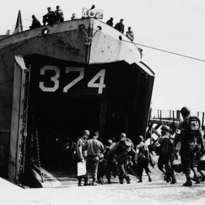 Members of a medical unit file aboard an LST. 7th June 1944 Members of a medical unit file aboard an LST. 7th June 1944