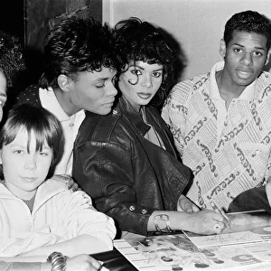 Some members of pop group Five Star meeting some of their young fans. 23rd March 1988