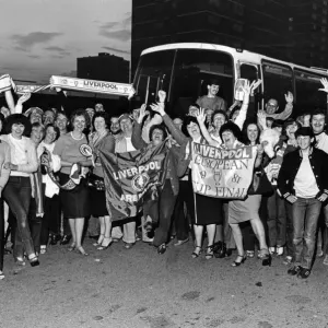 Black and white print of a group of people posing in front of a coach Black and white print of a group of people posing in front of a coach